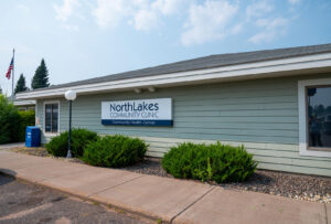 Exterior shot of light green building with NorthLakes Community Clinic sign