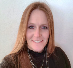 Selfie of woman with straight light colored hair smiling